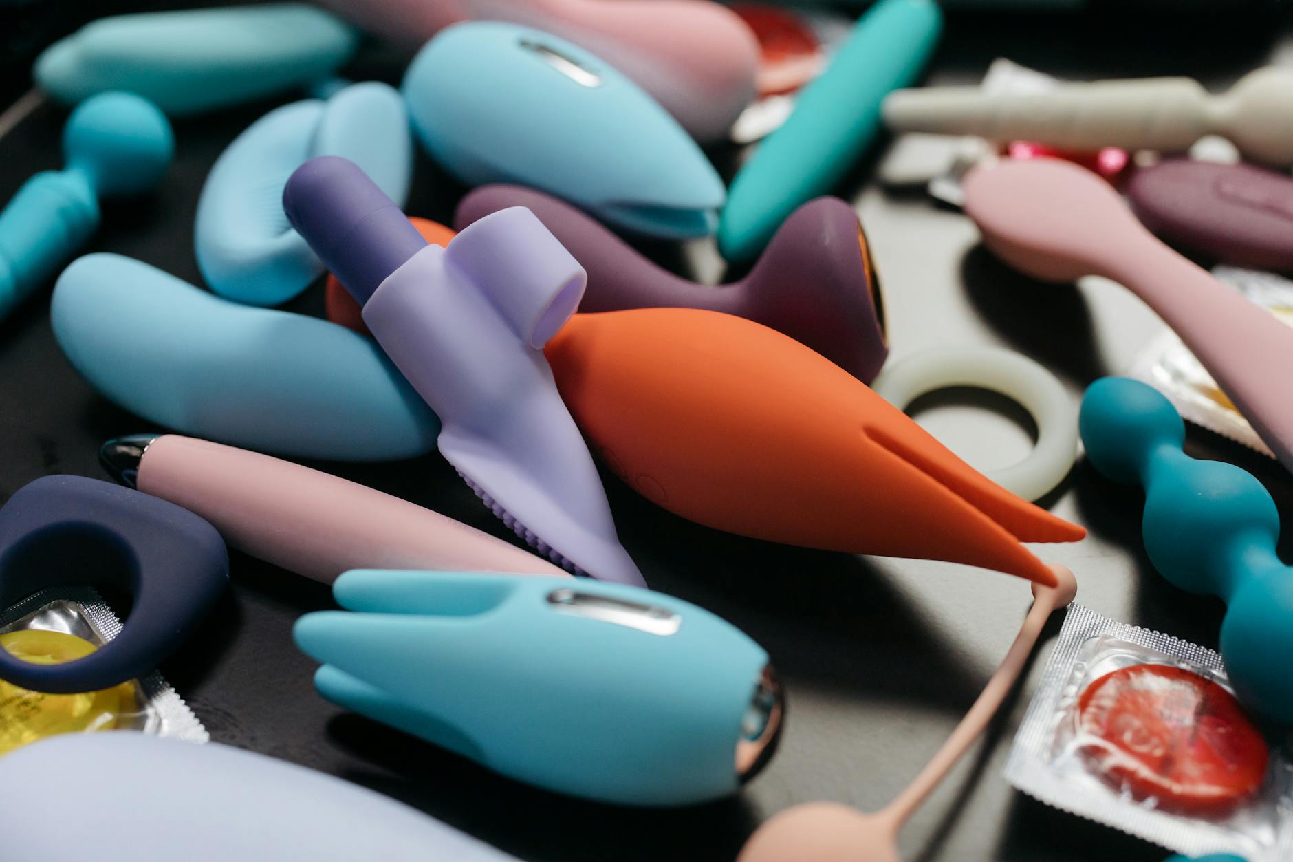Hands holding a sleek vibrator, symbolizing intimate reconnection after emotional recovery