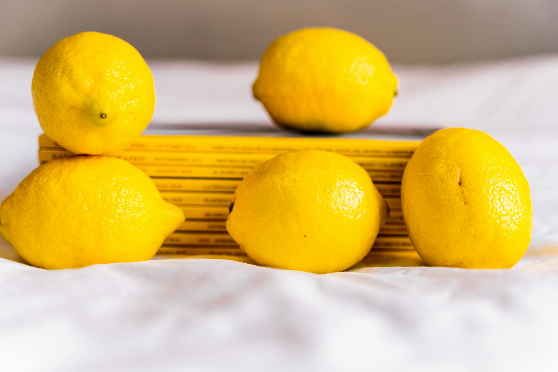 Close-up of a lemon vibrator held against a minimalist background, symbolizing renewed sexual pleasure